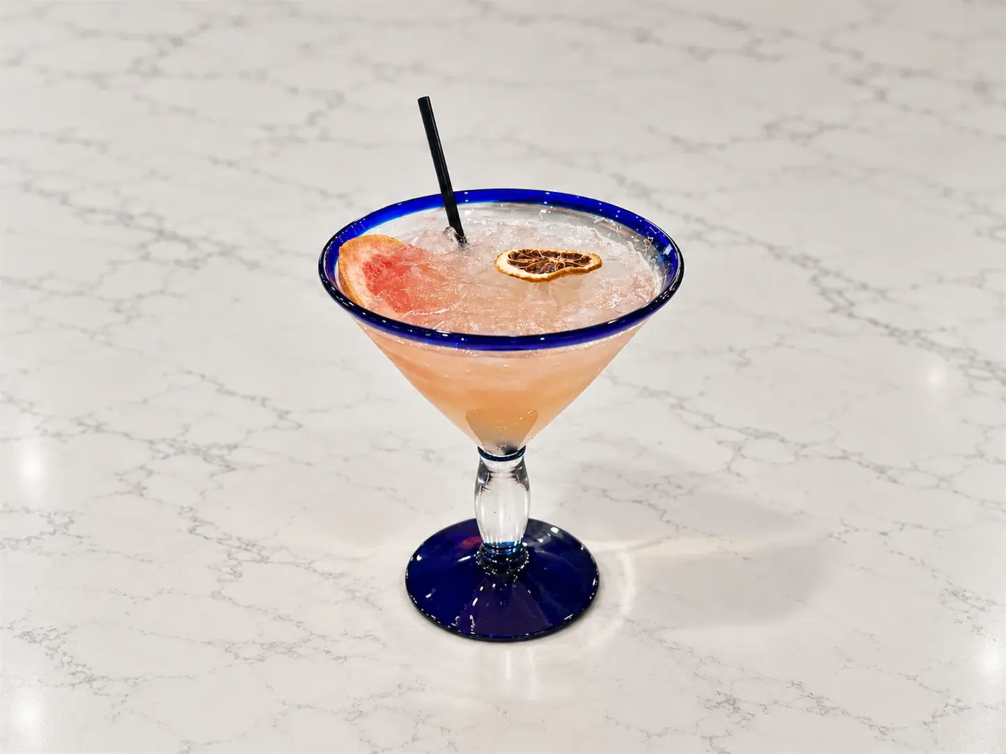 House margaritas served with fresh citrus at Aruma