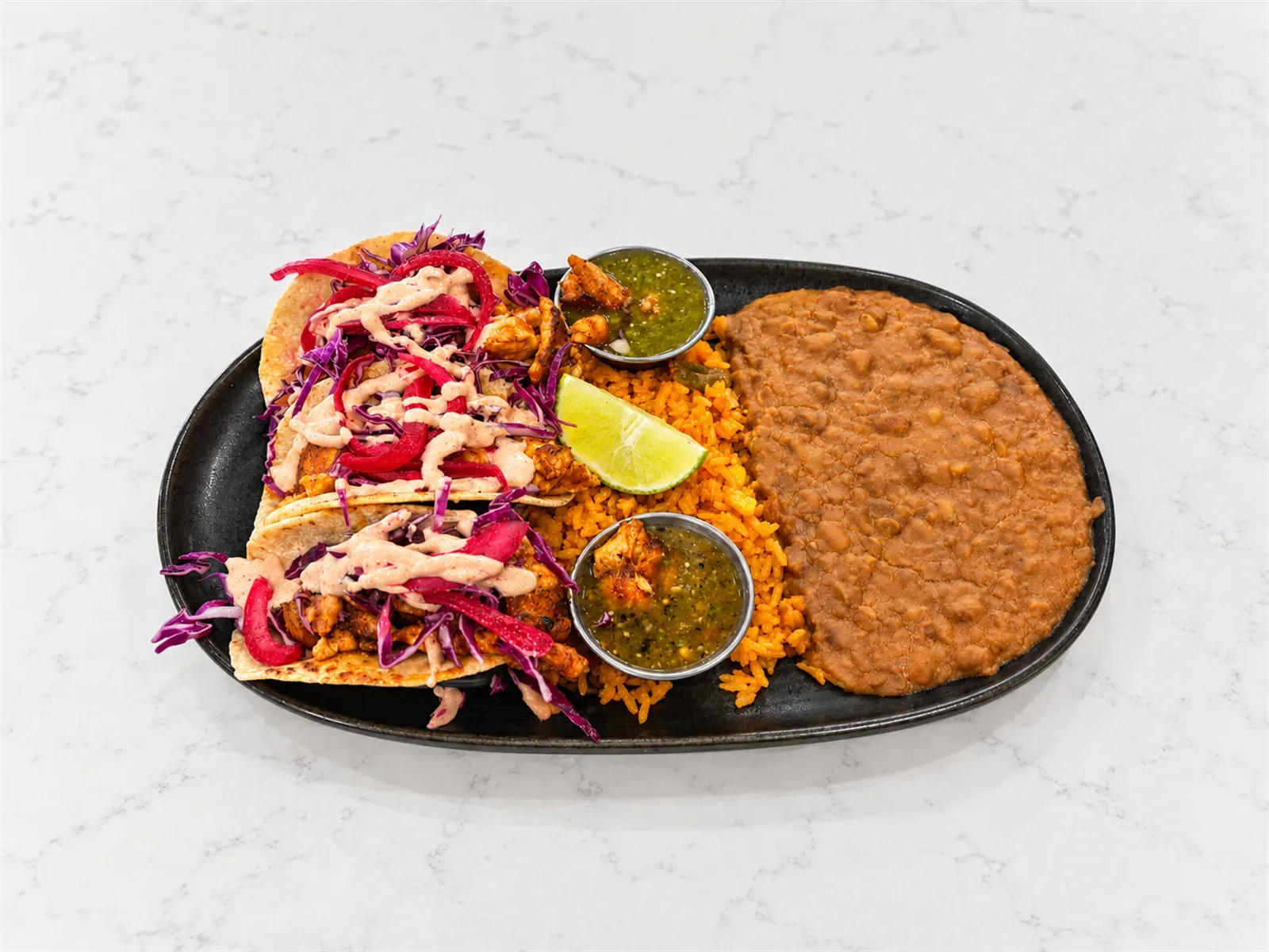 Walleye street tacos with cabbage, curtido, and chipotle crema