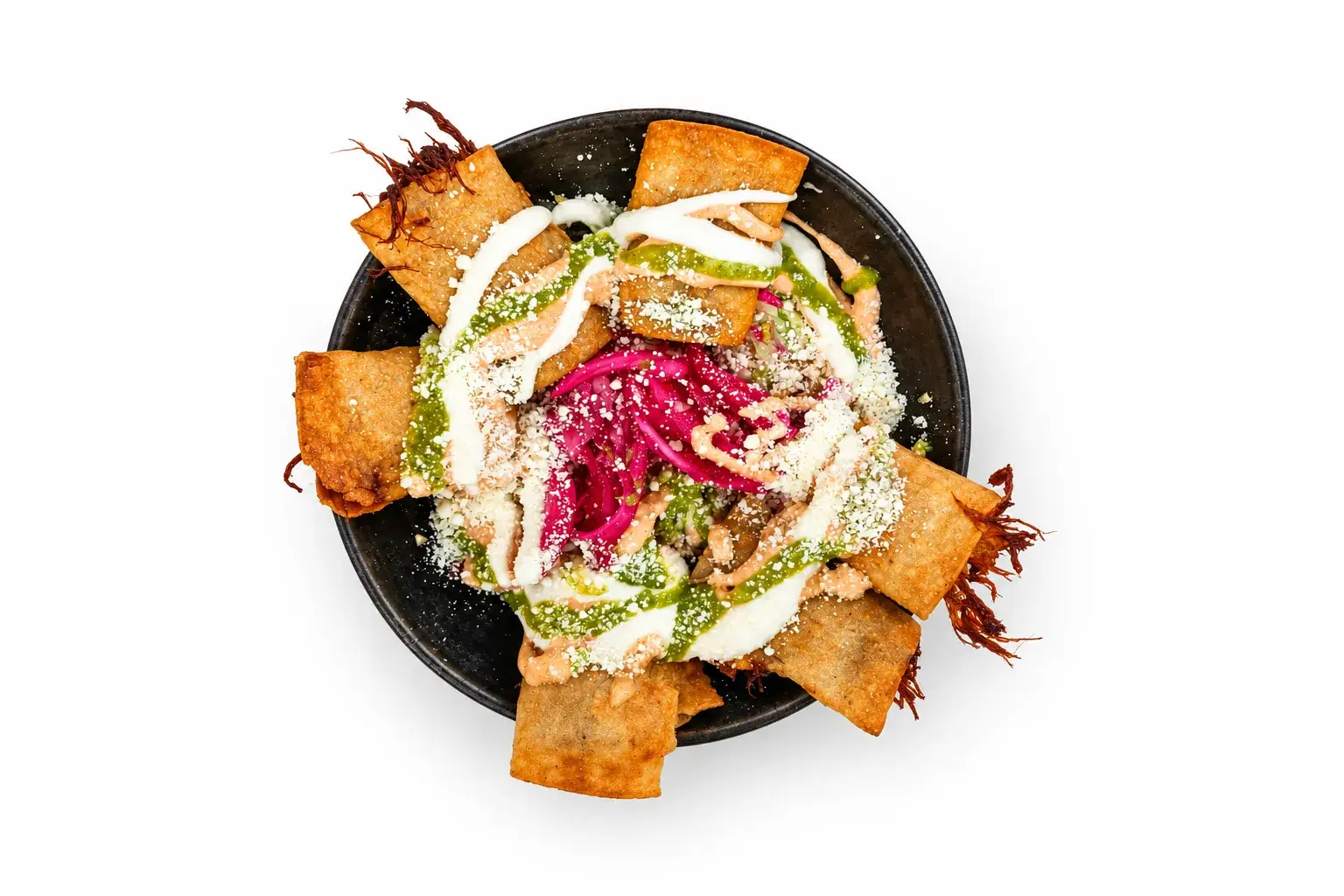 Tres doraditos with avocado sauce, crema, curtido, and cotija